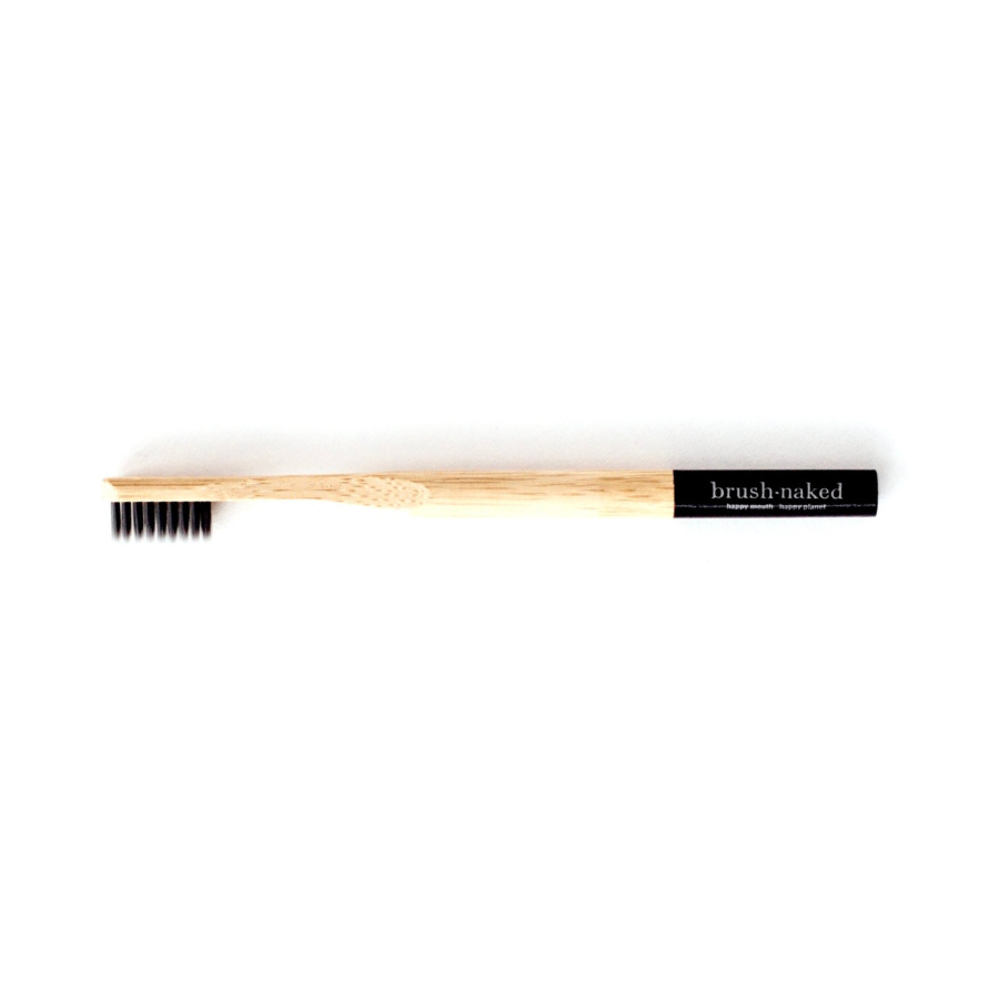 Brush Naked bamboo toothbrush with black, charcoal, bristles and rounded handle.