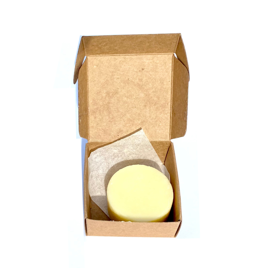 Overview of open box containing Diphy Wellness peppermint lotion bar.