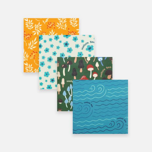 Orange fern, cerulean flower, green toadstool and blue wave beeswax wraps.