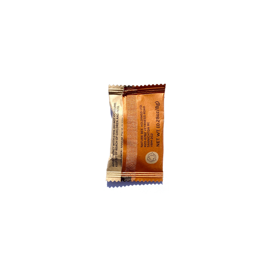 Reverse of paper package containing Nature Bee honey clementine foaming hand soap tablet.